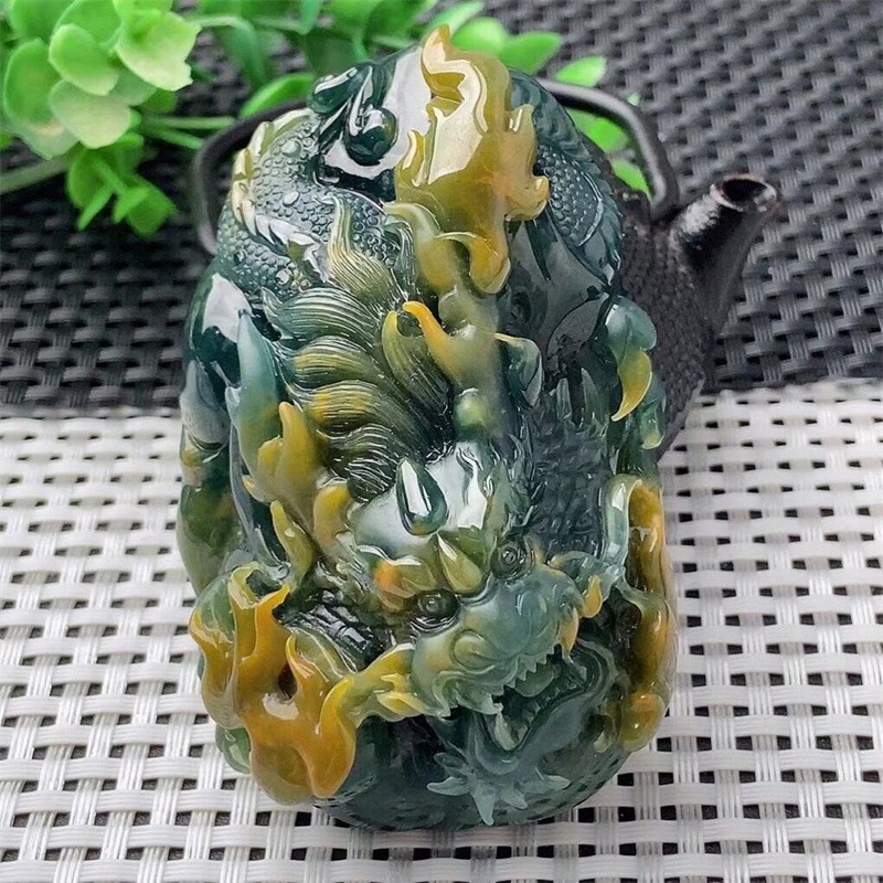 High quality natural gemstones are custom-carved on a Burmese jade dragon plate necklace jade pendant