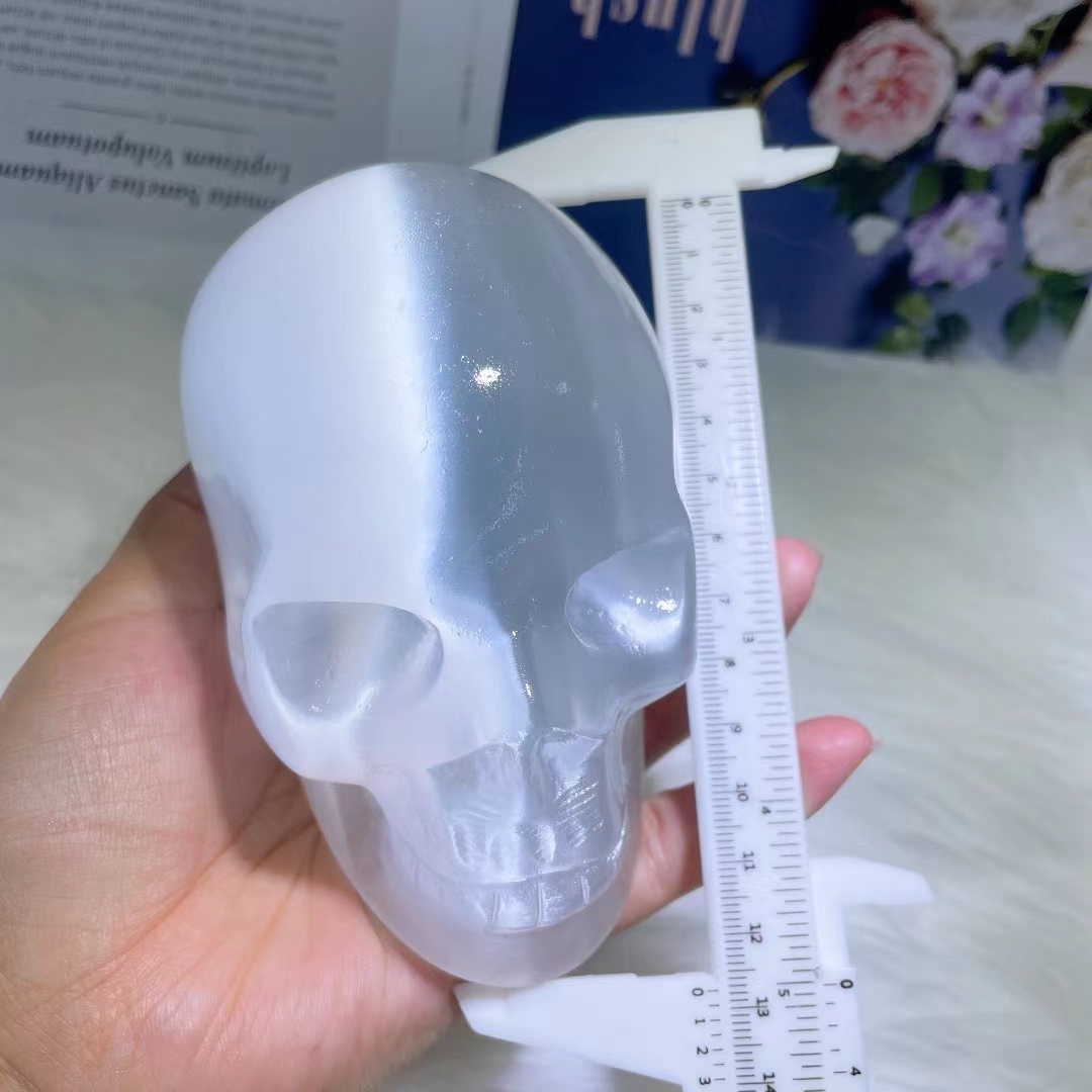 Natural hand carved skull wholesale healing clear gypsum crystal skulls carving crafts for home decoration