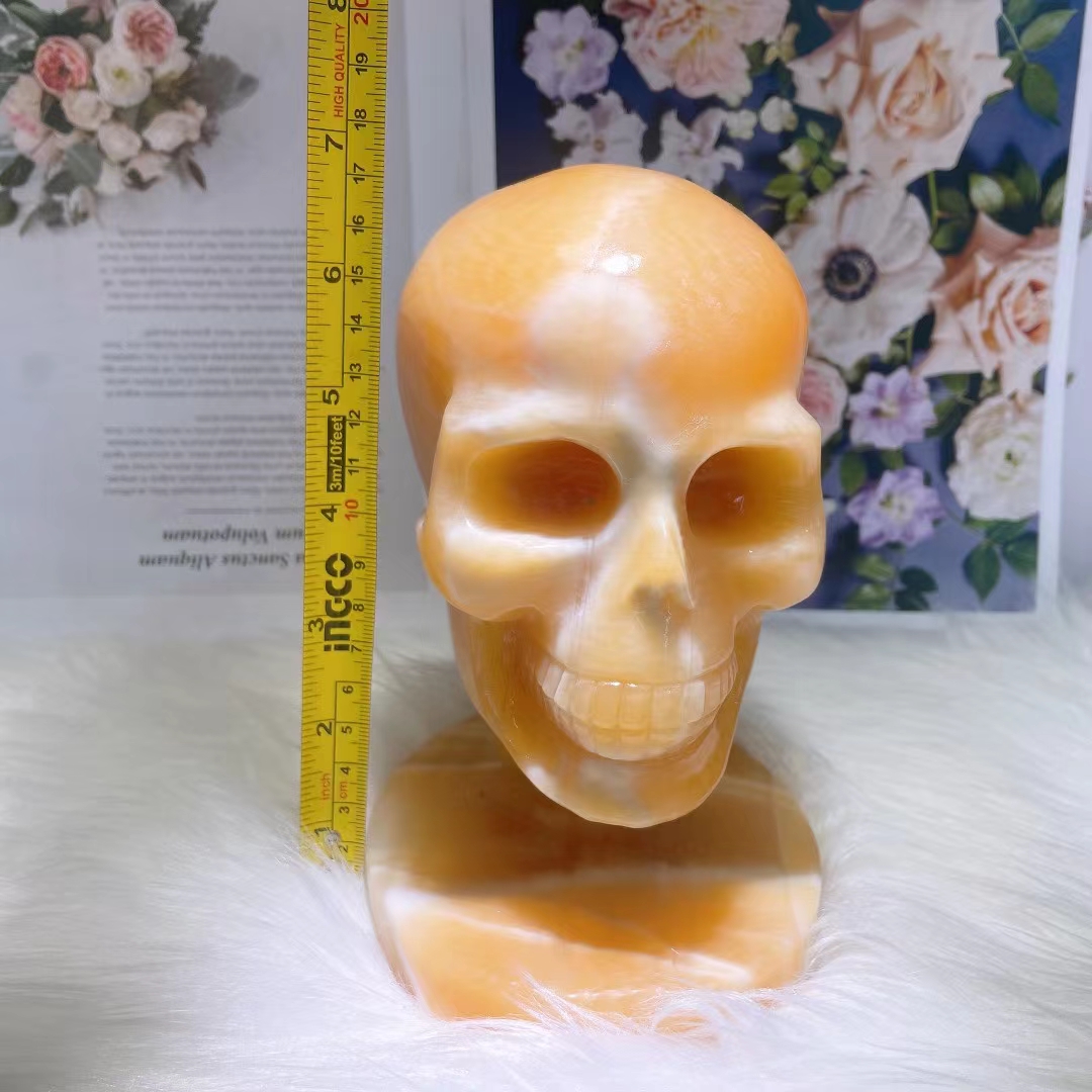 Polished healing hand carved skulls wholesale natural yellow calcite crystal carving skull for crafts gifts