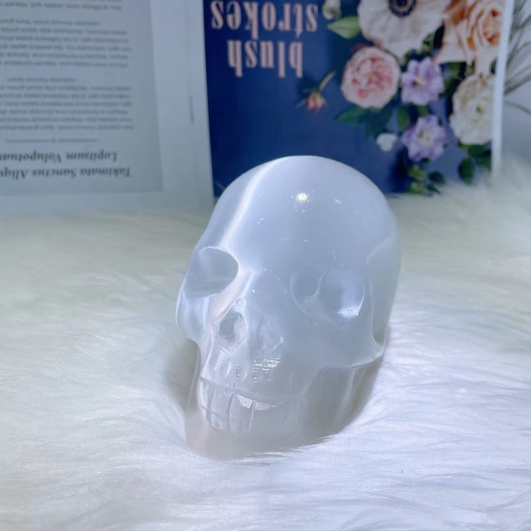 Natural hand carved skull wholesale healing clear gypsum crystal skulls carving crafts for home decoration