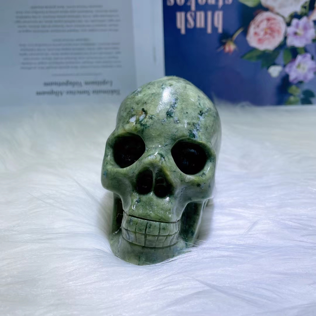 Wholesale high quality natural crystal skull folk crafts healing polished serpentine crystal carving skull for fengshui