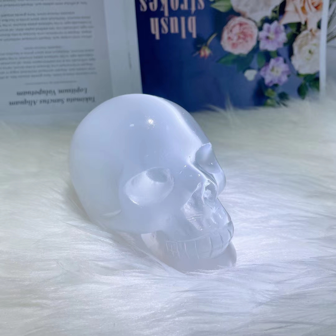 Natural hand carved skull wholesale healing clear gypsum crystal skulls carving crafts for home decoration