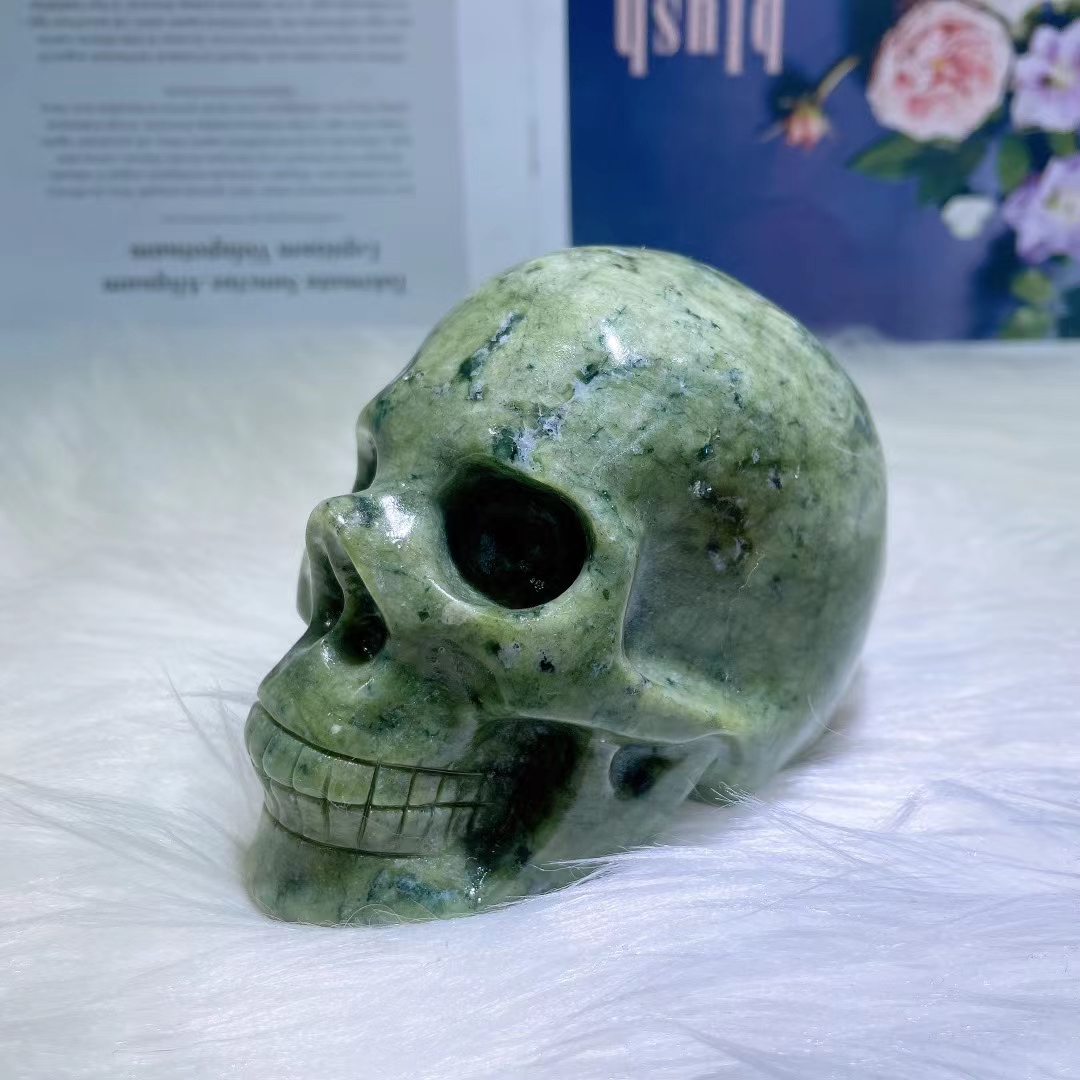 Wholesale high quality natural crystal skull folk crafts healing polished serpentine crystal carving skull for fengshui