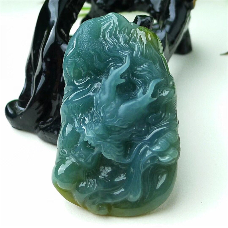 High quality natural gemstones are custom-carved on a Burmese jade dragon plate necklace jade pendant