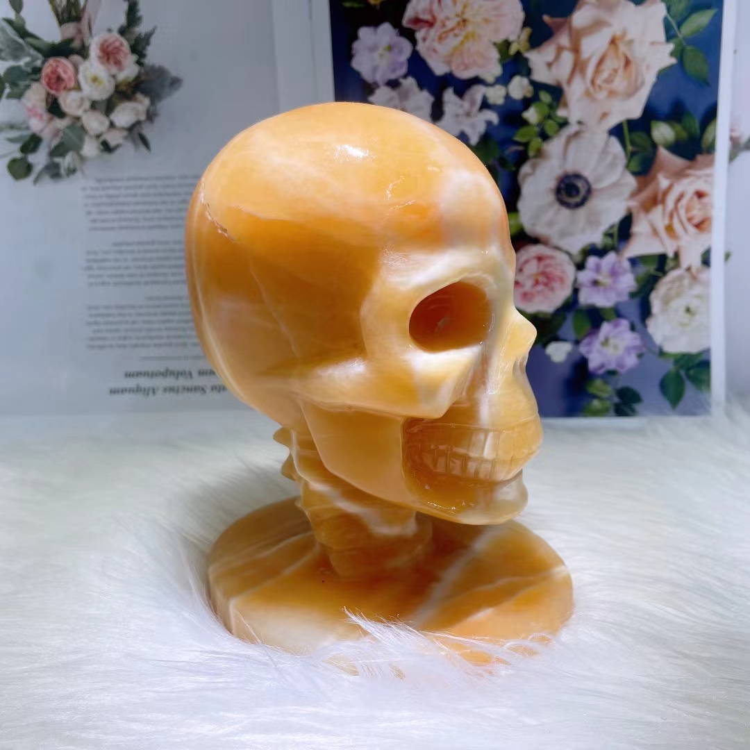 Polished healing hand carved skulls wholesale natural yellow calcite crystal carving skull for crafts gifts